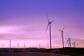 Wind turbine farm during beautiful sunset, Alternative green energy