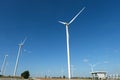 Wind turbine farm in the field - a renewable energy source Royalty Free Stock Photo