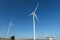 Wind turbine farm in the field - a renewable energy source Royalty Free Stock Photo