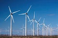wind turbine farm with rows of spinning blades in the background Royalty Free Stock Photo