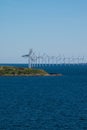 Wind turbine farm and small island in Baltic Sea between Germany Royalty Free Stock Photo