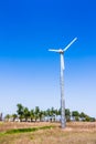 Windmill power generator in beautiful nature landscape for production of renewable green energy. Wind turbine generating Royalty Free Stock Photo