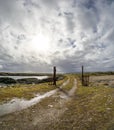 A Wind turbine is generating in Burtonport harbour, Countz Donegal, Ireland Royalty Free Stock Photo