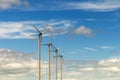 Wind turbine generating electricity on blue sky with clounds,Windmills for electric power ecology concept Royalty Free Stock Photo