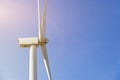 Wind turbine generating electricity on blue sky with clounds,Windmills for electric power ecology concept Royalty Free Stock Photo