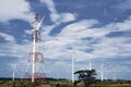 Wind turbine for generating electricity on high mountains in Thailand The background is a blue sky and white clouds Royalty Free Stock Photo