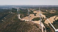 Wind turbine on green fields in summertime. Natural wind power plants and sustainable eco-friendly energy resources