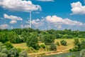 Wind turbine on the hill produces green clean energy Royalty Free Stock Photo