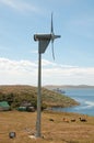 Wind turbine on isolated farm.