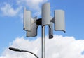 Wind turbine and lamp against the sky, alternative energy