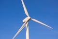 Wind turbine mill with deep blue background - close up with copy space Royalty Free Stock Photo