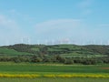 Wind turbine power generator installation in fields Royalty Free Stock Photo