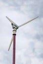 Wind turbine producing alternative energy. Wind turbines generating electricity with blue sky - energy conservation concept Royalty Free Stock Photo