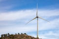 Wind turbine, renewable energy on a rocky hill Royalty Free Stock Photo