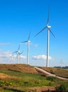Wind turbine renewable energy source summer landscape with blue sky in natural landscapes Royalty Free Stock Photo