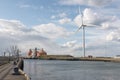 Wind Turbine, silos & sculpture on banks of River Blyth, Northumberland, UK