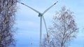 Wind turbine in a snowy landscape with early winter morning mist Royalty Free Stock Photo