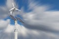 Wind turbine with solar panels on pillar Royalty Free Stock Photo