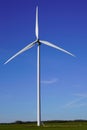 Wind turbine in summer day up Colorful blue sky Alternative energy concept Royalty Free Stock Photo