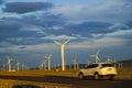 Wind turbine at sunset with beautiful clouds Royalty Free Stock Photo