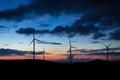 Wind turbine sunset time, silhouette Royalty Free Stock Photo