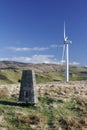 Wind turbine with trig point Royalty Free Stock Photo