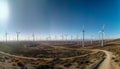 Wind turbine turning, generating renewable energy for sustainable development generated by AI Royalty Free Stock Photo