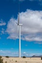 Wind turbine under a blue sky with white clouds in New Mexico