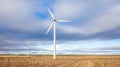 Wind turbine in wheat fiel and cloudy Royalty Free Stock Photo