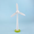 Wind turbine wooden toy or light blue background, eco concept