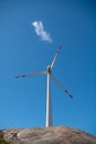 Wind turbines agains a blue sky.