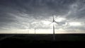 Wind Turbines Against a Brooding Sky at Dusk