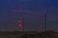 Wind turbines against the setting sun