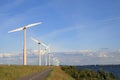 Wind turbines along the lake Royalty Free Stock Photo