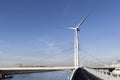 Wind turbines and an asphalted bicycle path Royalty Free Stock Photo