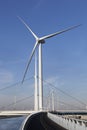 Wind turbines and an asphalted bicycle path Royalty Free Stock Photo