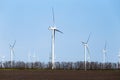 Wind turbines on an autumn or spring field Royalty Free Stock Photo