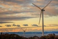 Coastal Wind Turbines Tower above Sea with Dramatic Sunset Sky Royalty Free Stock Photo