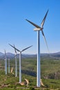 Wind turbines on beautiful sunny summer mountain landscape