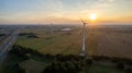 Wind turbines on beautiful sunny summer purple autumn rural agraric landscape. Green ecological power energy generation Royalty Free Stock Photo