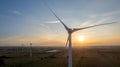 Wind turbines on beautiful sunny summer purple autumn rural agraric landscape. Green ecological power energy generation Royalty Free Stock Photo