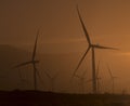 Wind turbines in blowing dust at sunset near Palm Springs CA