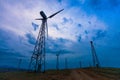 Wind turbines on dark sky background. Alternative energy source Royalty Free Stock Photo