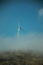 Wind turbines for electric power generation and mist Royalty Free Stock Photo