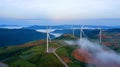 Wind turbines farm clean green energy for electric this is aerial view flying from Drone