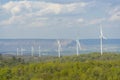 A Wind turbines farm on the hill. Alternative energy source. Royalty Free Stock Photo