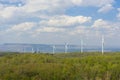 A Wind turbines farm on the hill. Alternative energy source. Royalty Free Stock Photo