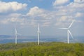 A Wind turbines farm on the hill. Alternative energy source. Royalty Free Stock Photo