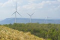 A Wind turbines farm on the hill. Alternative energy source. Royalty Free Stock Photo