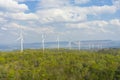 A Wind turbines farm on the hill. Alternative energy source. Royalty Free Stock Photo